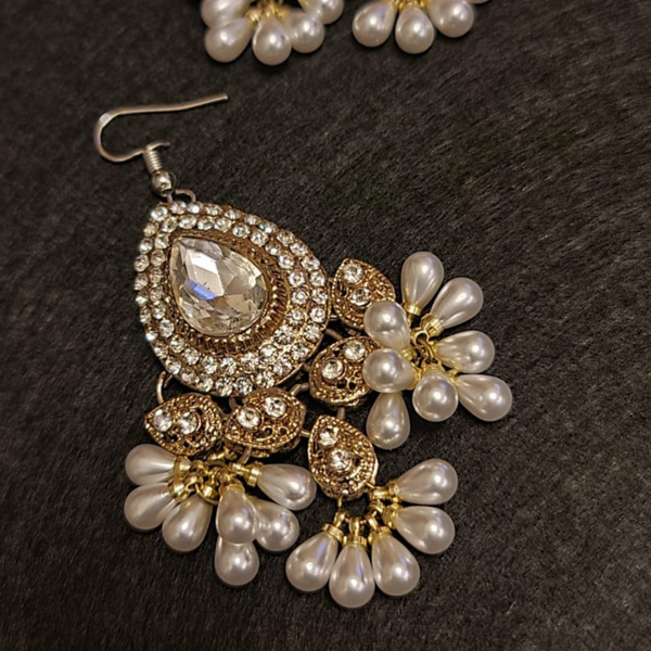 Traditional diamond cut stones and pearl  earrings, tikka set