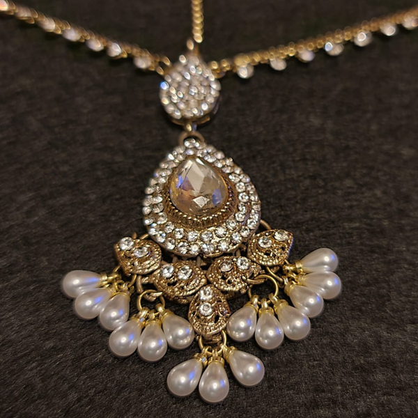 Beautiful indian traditional maang tikka with diamond cut stones and pearls