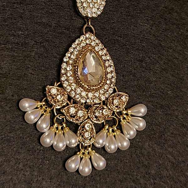 Beautiful indian traditional maang tikka with diamond cut stones and pearls