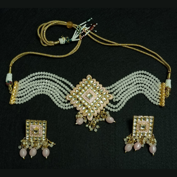 Kundan pink moti choker necklace with earrings.