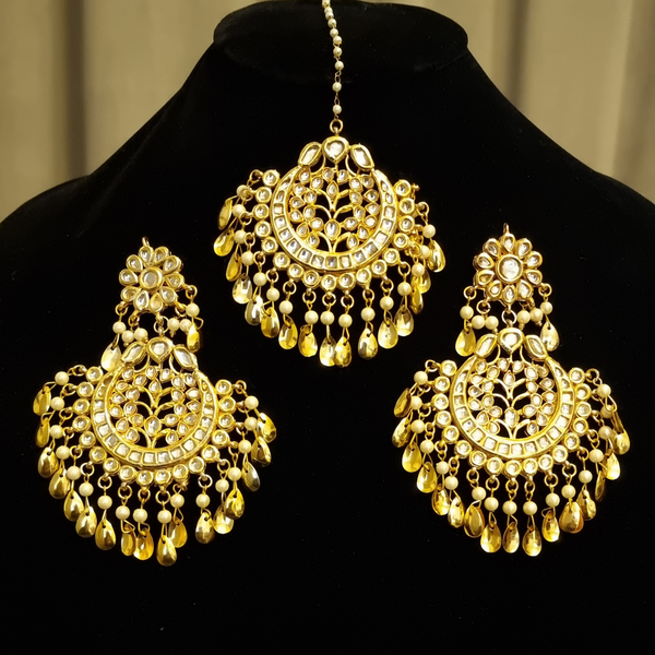 Kundan with golden pipal patti  earrings and tikka.