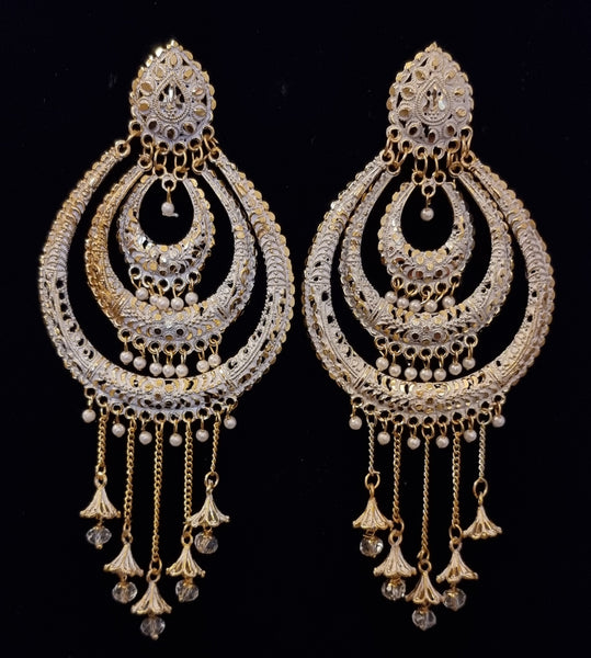 Long jhumka style earrings with tassels.