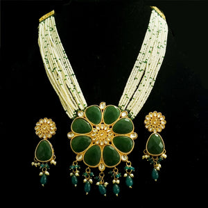 Multi - Strand pearl haram with kundan and emerald stones necklace set with earrings.