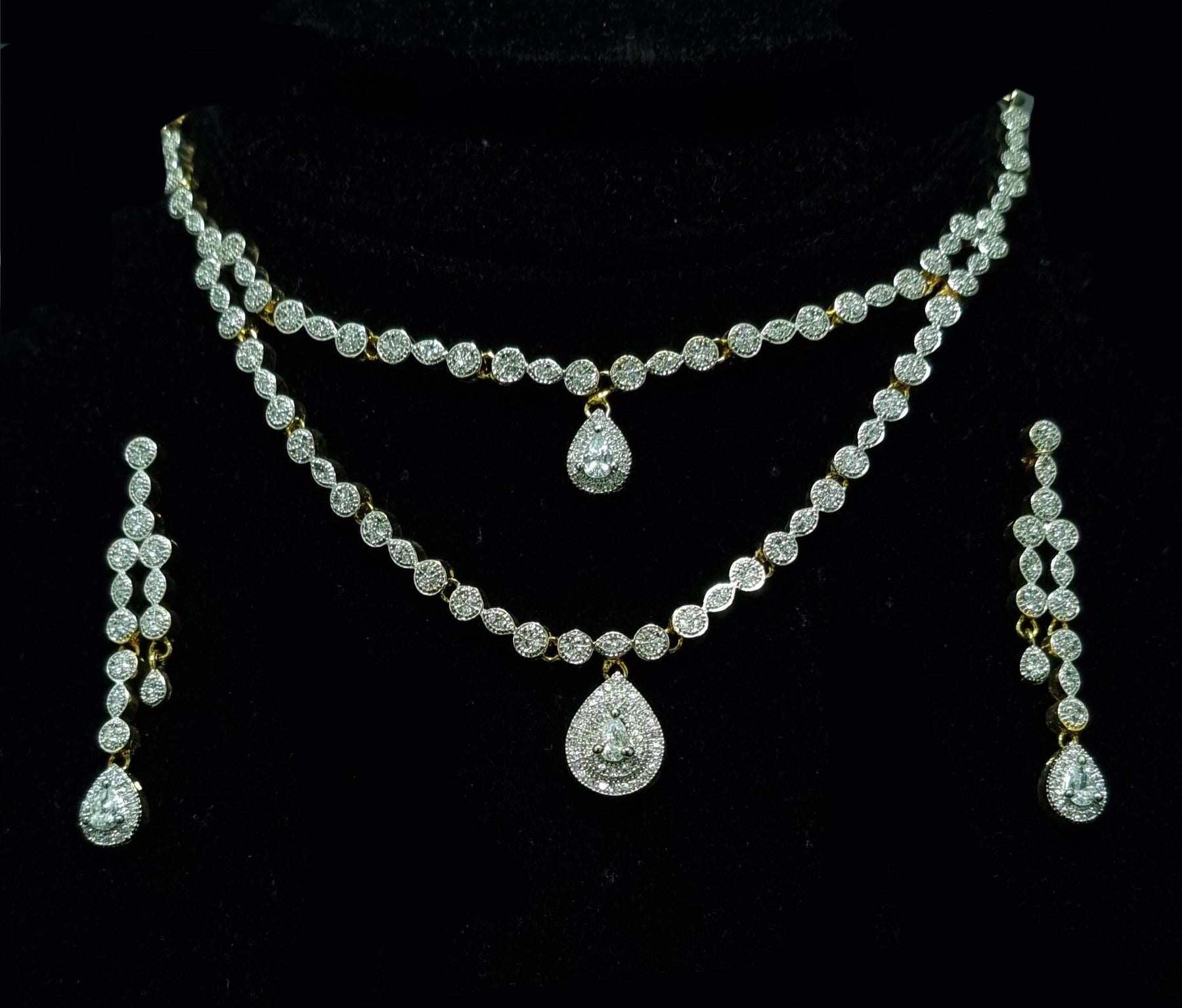 Silver 925 Gold-Plated Alluring Duo Layered Diamond- Like Stones Studded Necklace With A Tear Shaped Diamond-LIKE Necklace Earrings Set.