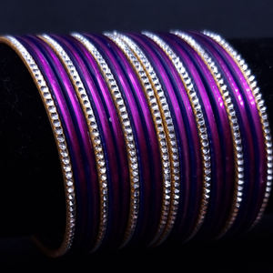 Purple with silvertone metal bangles.