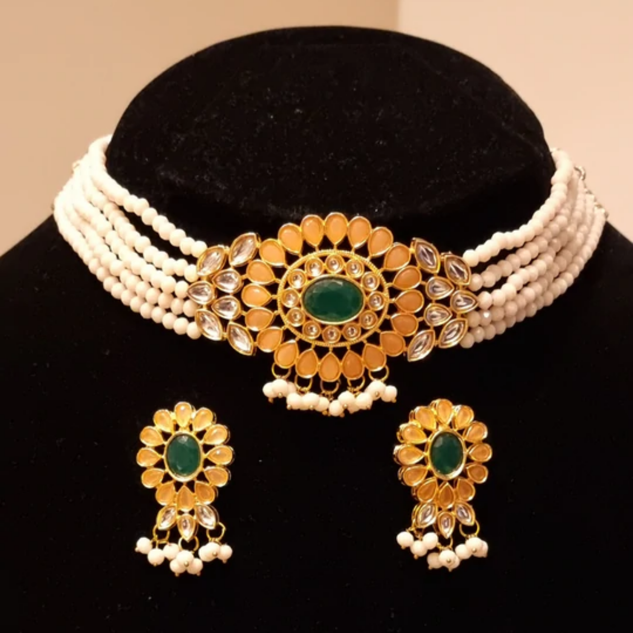 Kundan stones pearl choker necklace with earrings.