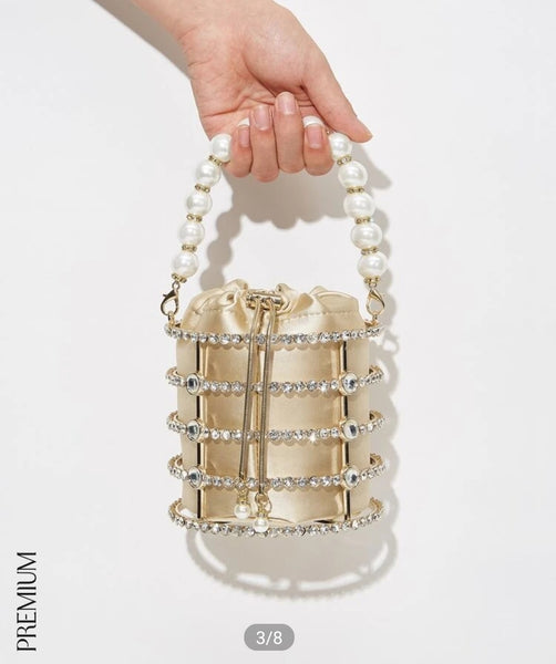 Premium faux pearl beaded clutch bag.