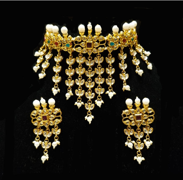 Maharaani kundan choker with 7 layered kundan malaa and earrings with nath and maang tikka.