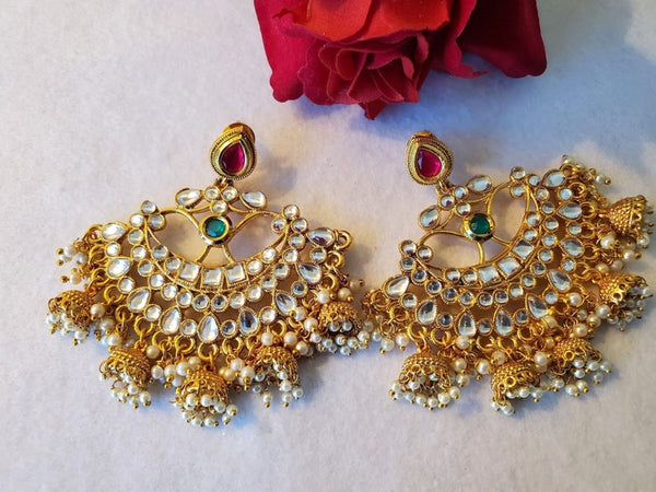 Gold plated chandbali with kundan and jhumkis.